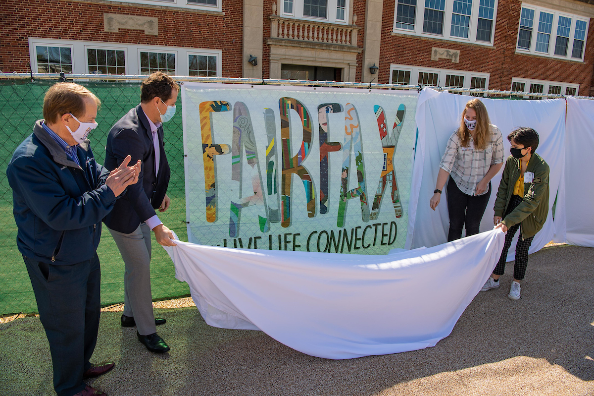 Mayor David Meyer, Enrico Cecchi, student Sofia Mesa-Morales and Mrs. PJ Naber unveiling their piece, "#Fairfax."
