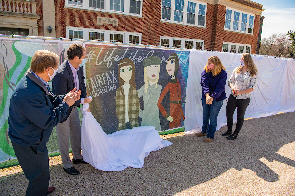 Mayor David Meyer, Enrico Cecchi, student Isabela Colon-Mathews and Mrs. PJ Naber unveiling Isabela Colon-Mathews' piece, "#Socializing."